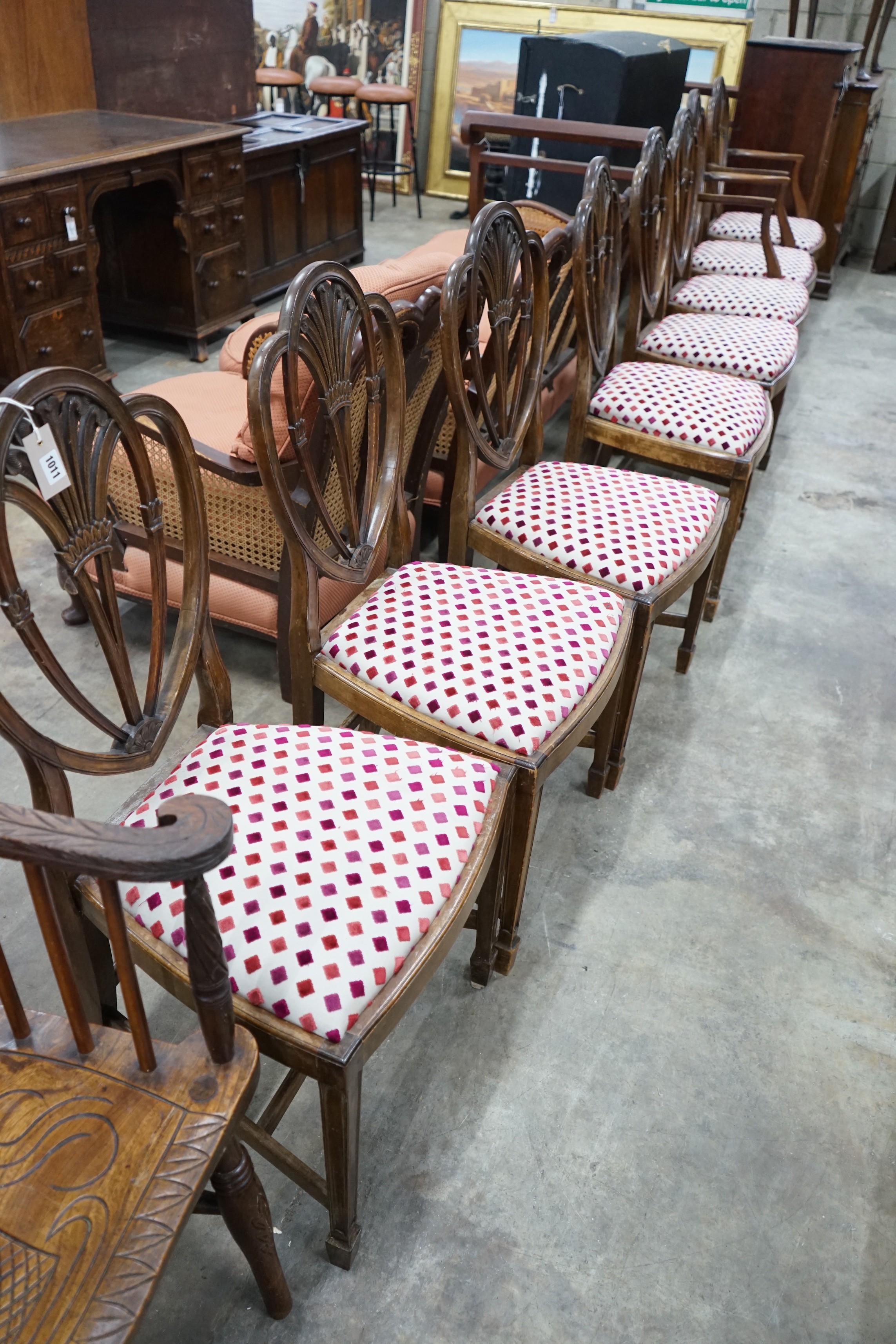 A set of eight Hepplewhite style mahogany dining chairs, two with arms